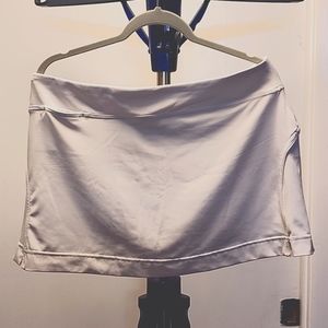 White tennis skirt with inner shorts and a key pocket